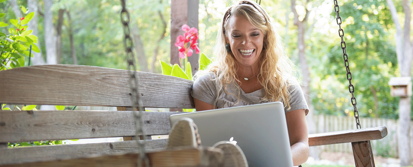 Online learner on porch swing