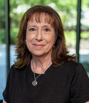 female headshot wearing a black shirt