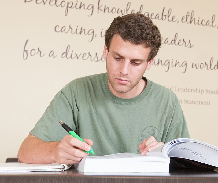 student sitting at a computer