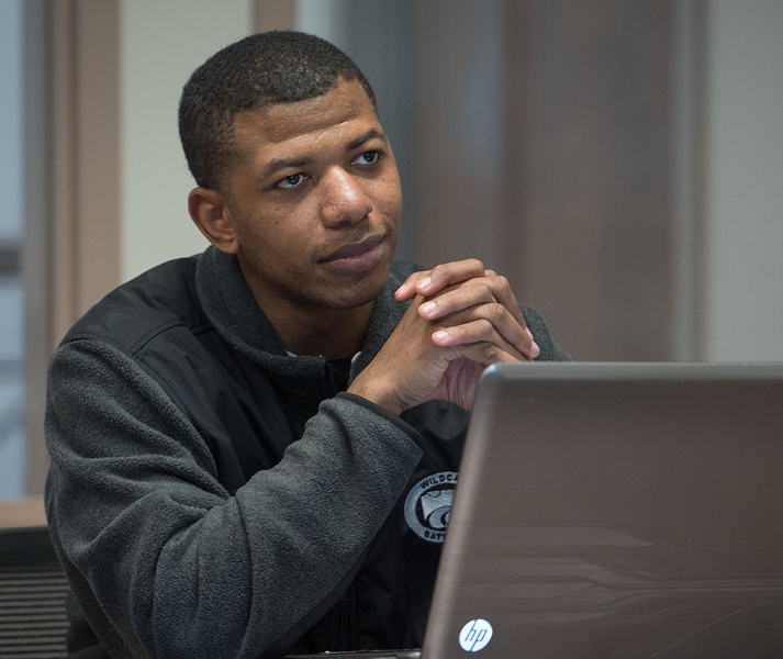 student sitting at a computer